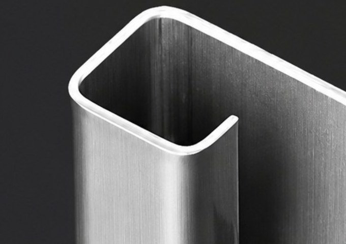 Folded stainless steel channel with a round outside corner, bent on a press brake without V-grooving