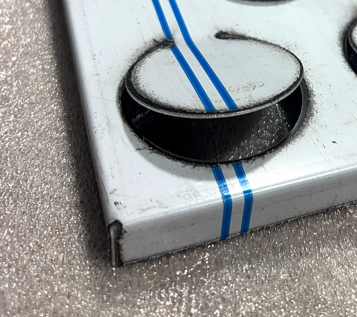 Metal Coin Façade Panels: bent edge close-up 2