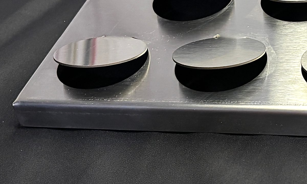 Metal Coin Façade Panels: bent edge close-up 3
