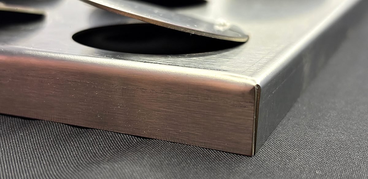 Metal Coin Façade Panels: bent edge close-up 4