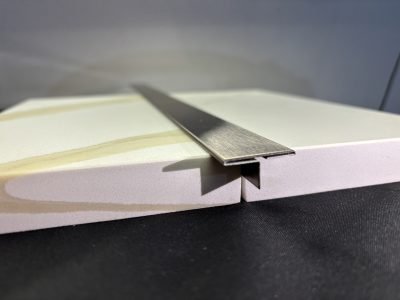 Stainless steel T profile set into a marble edge