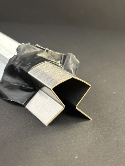 Corner guard profile with protective film, end view