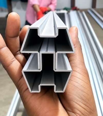 Custom multi-channel architectural profile held in hand
