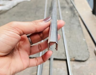 Custom U profile sample held in hand