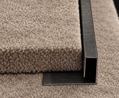 P channel edge trim in stainless steel on carpet — P Channel · Architectural Profiles