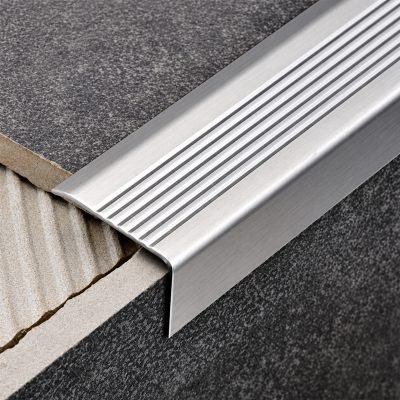 Stair edge nosing in brushed stainless steel on tiled steps