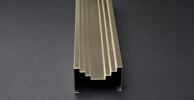 Stepped highlighter strip in champagne finish