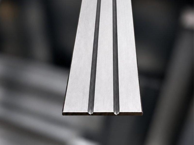 Stainless steel profiles with the V-grooves cut, ready to bend