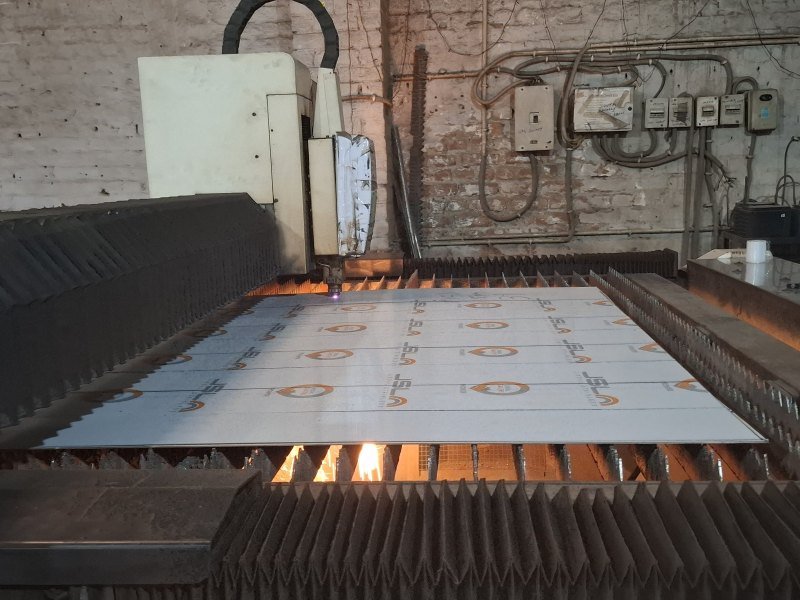 CNC fibre laser cutting a stainless steel sheet