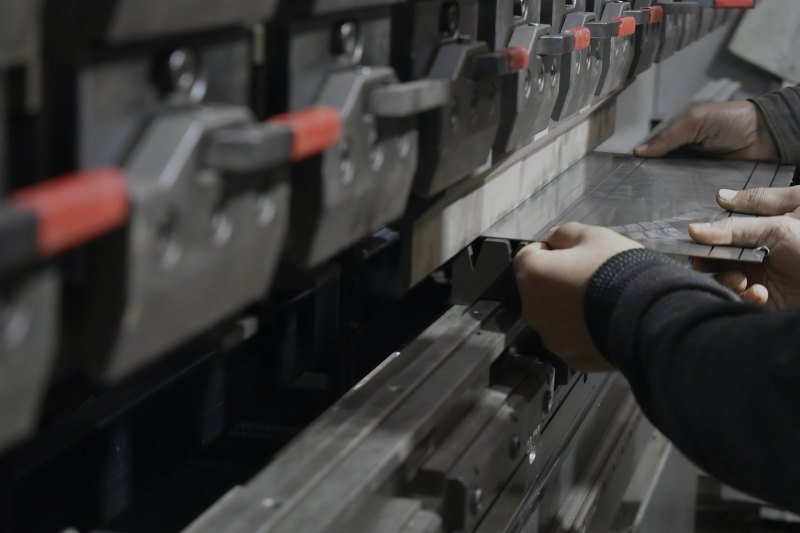 CNC press brake bending a stainless steel sheet