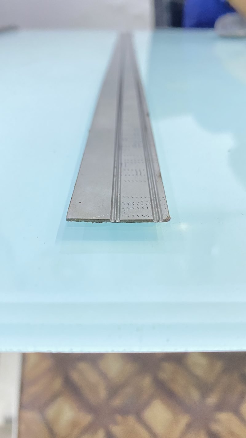 V-grooves milled along every bend line of the flat blank