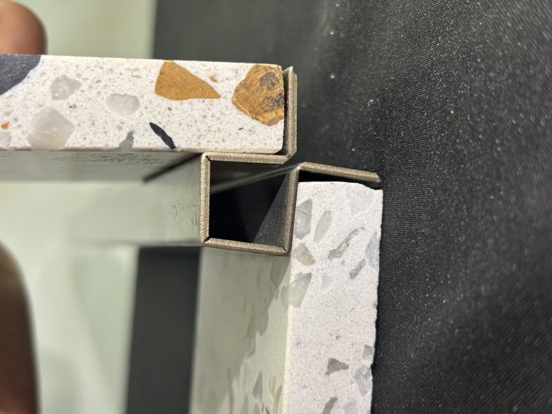 Custom brass corner profile for architectural edge protection