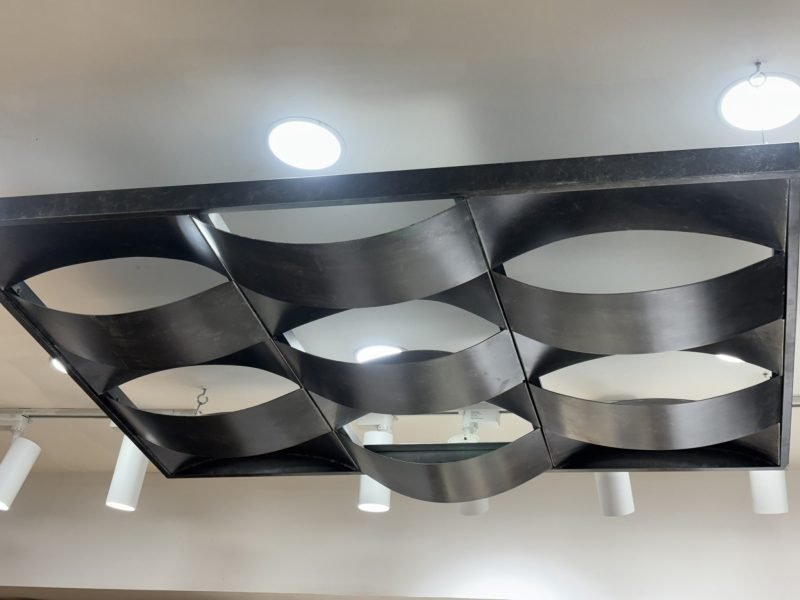 Curved metal ceiling panels in the showroom
