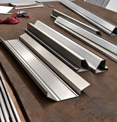 Illustration: stainless steel folded sections on a bench