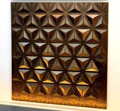 3D folded façade panel with triangular relief, bronze finish