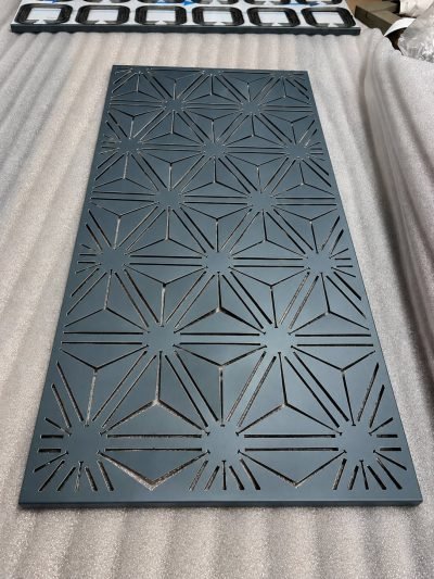3D folded façade panel with a star pattern, laid flat