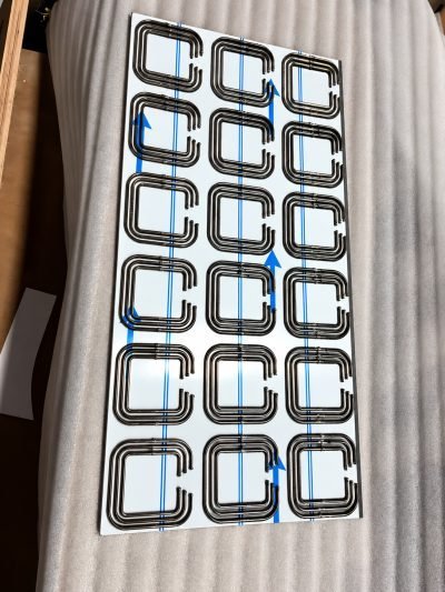 3D folded façade panel with folded square tabs, packed