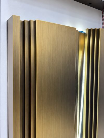 Inter-lock wall panels in brushed bronze with vertical ribs