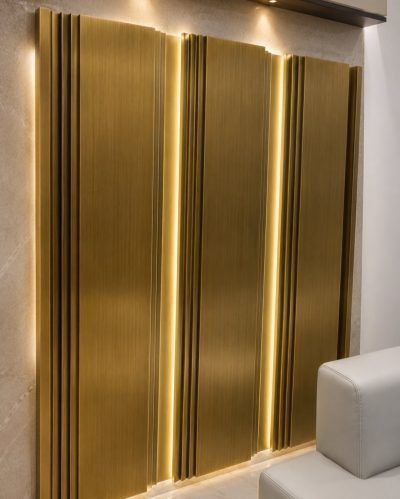 Inter-lock wall panel in brushed brass with lighting