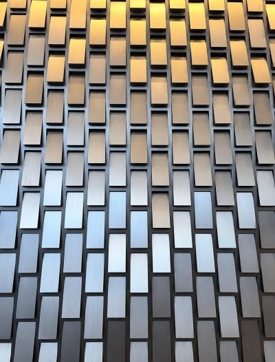 Kinetic façade panel with angled stainless steel tiles, close view