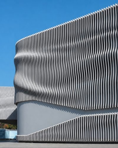 Parametric fin façade on a building, wave form — Parametric Façade Panels · Façade Systems