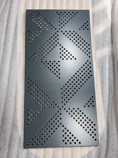 Perforated panel with a diamond dot pattern, dark grey