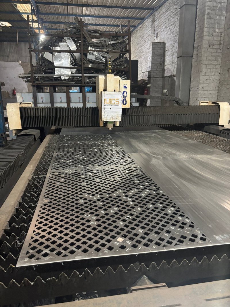 CNC fibre laser cutting a perforated sheet