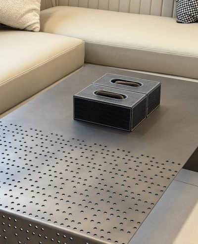 Perforated metal coffee table with a stainless steel frame