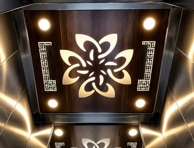 Lift ceiling panel with a laser-cut floral motif and downlights
