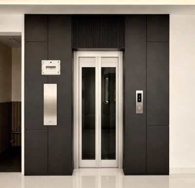 Lift cladding in black with a stainless steel door — Lift Cladding · Lift Solutions