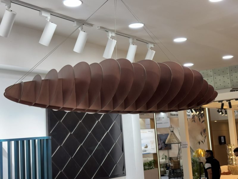 Fluted wall panels under a suspended feature