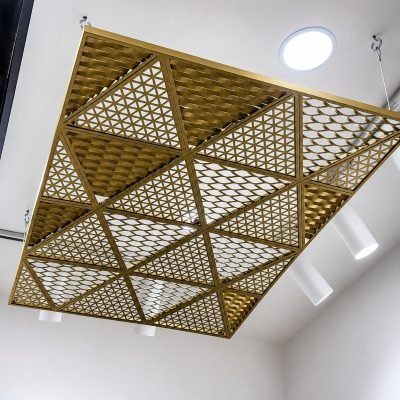 Brass-finish triangular laser-cut ceiling panel