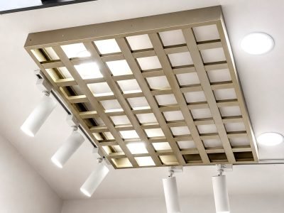 Open cell metal ceiling panel with downlights