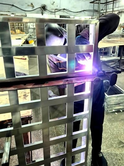 Welding a metal ceiling grid at the workshop — Ceiling Grid Systems · Metal Ceilings