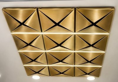 Illustration: brass-finish triangular ceiling panels