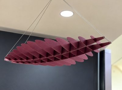 Maroon layered feature ceiling element suspended on wires
