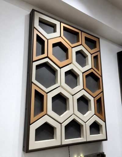 Honeycomb ceiling panel with hexagon cells in bronze and champagne finishes, angled view