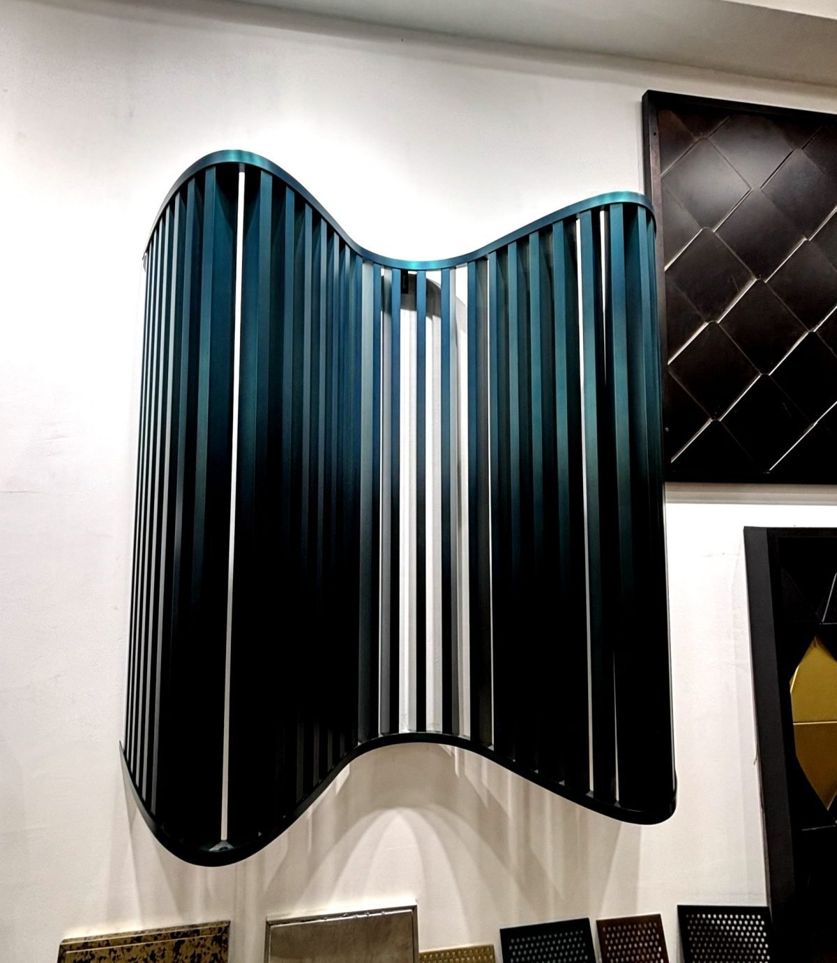 Parametric wall panel with curved fins in teal, showroom