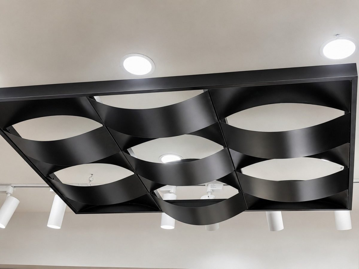 Black wave metal ceiling with curved strips in a grid frame