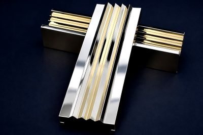 Decorative louver strips in mirror stainless and brass finishes