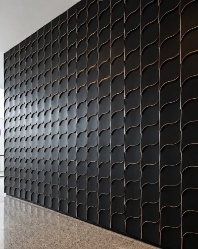 Wave pattern shingles in black, wall detail