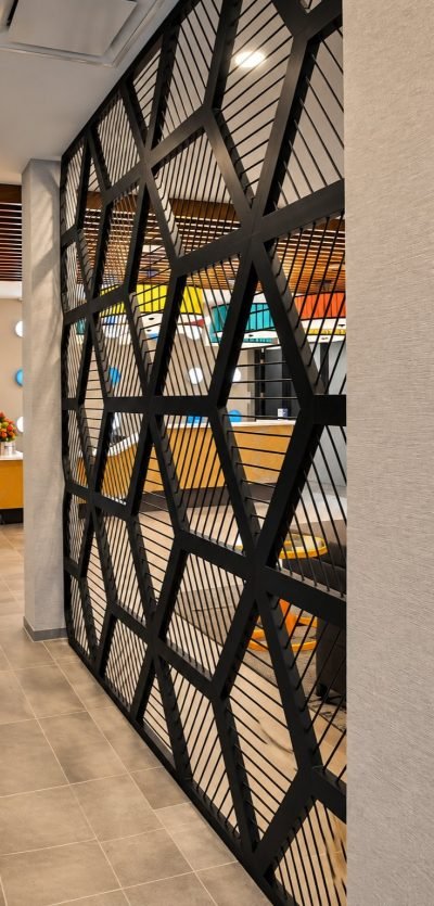 Office partition with a curved slat pattern in black — Office Partitions · Partitions