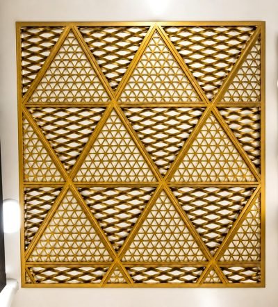 Expanded metal mesh panel in brass finish with triangular frames