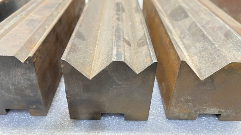 Press-brake V-dies ground for sharp-edge bending