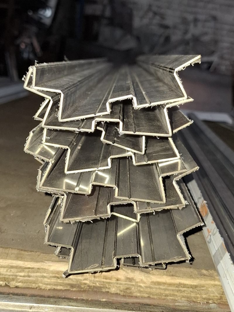 Multi-fold V-grooved profiles stacked in the workshop