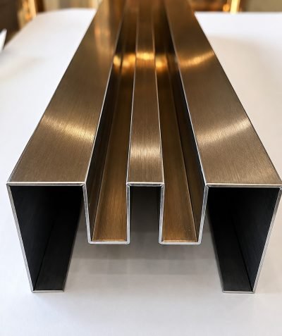 Bronze PVD box sections, studio photograph — Square & Rectangular Pipe Profile · Architectural Profiles