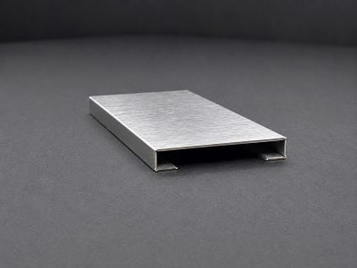 A flat stainless steel box section, V-grooved and closed — Square & Rectangular Pipe Profile · Architectural Profiles