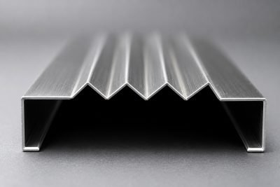 A zig-zag fluted section in stainless steel — Wall & Tile Highlighter Strips · Architectural Profiles