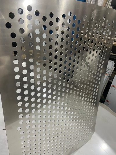 Gradient perforation on a stainless steel facade panel