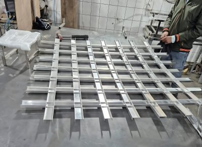 A grid ceiling module assembled on the bench